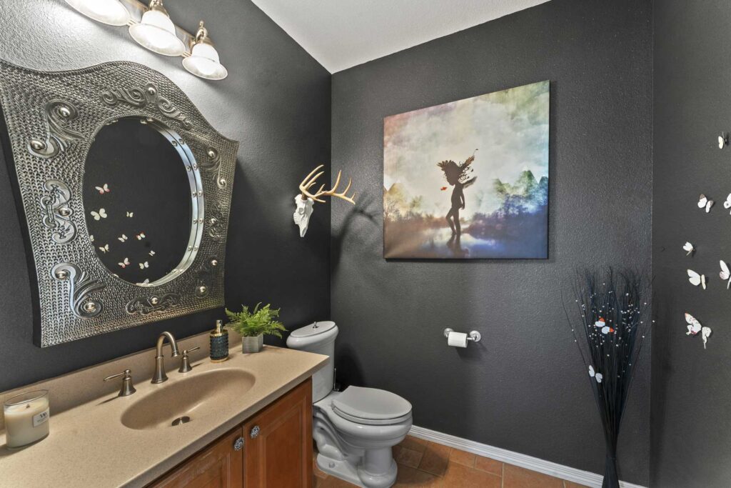 Real Estate photography of a half bath inside a Castle Rock Home