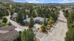 Aerial photography capturing a luxury Castle Rock real estate listing sitting on a corner lot.
