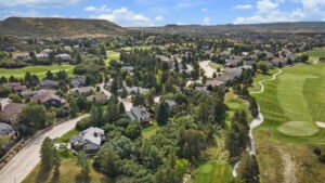 Aerial view of a luxury Castle Rock property with surrounded by golf courses.