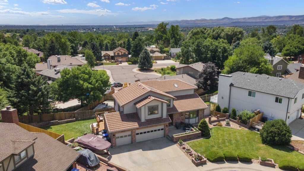Drone photo of a luxury home in Parker with 3 car garage and Mountain views